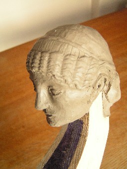 The clay maquette of the head. It’s based on a Roman female portrait bust from Pompeii, now in the archaeological museum in Naples, where I was able to photograph it.